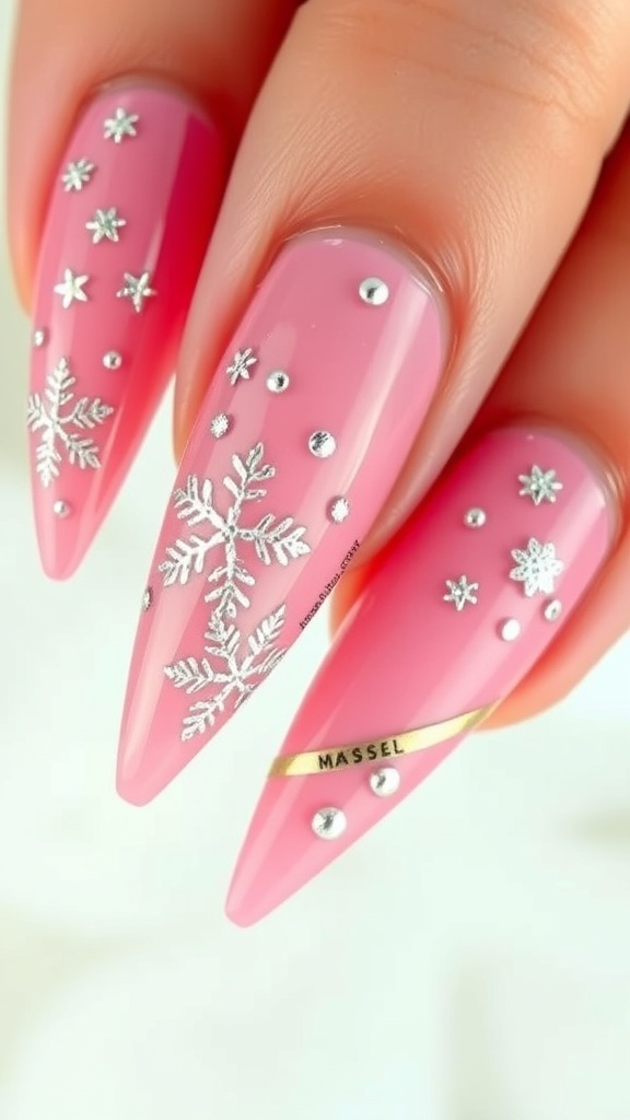 Elegant pink stiletto Christmas nails with snowflake designs and glitter accents.